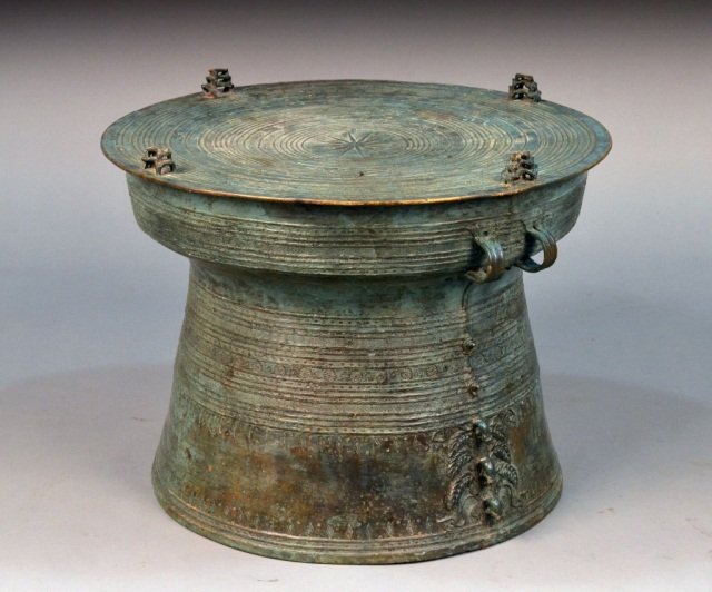 Patinated Bronze African Drum Table: Height 17 inches, diameter 22 inches.