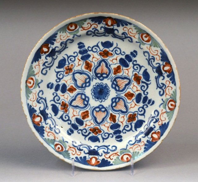 Tin Glazed Earthenware Plate: 18th century, stylized floral decoration. Diameter 8 3/4 inches.