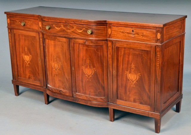 Edwardian Mahogany Server: Late 19th century, shaped rectangular line inlay top above a conforming drawer flanked by two short drawers over three cupboards with inlaid decoration. Height 38 1/2 inches, width 72 1/2 inches, dept