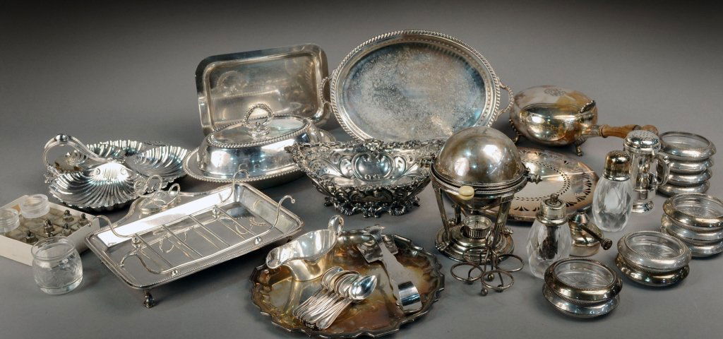 Miscellaneous Group of Silver Plated Articles: Including an asparagus dish, trivit, domed butter dish, covered entree dish, circular tray, divided tray, canoe shaped dish, set of sterling mounted glass coasters, etc.