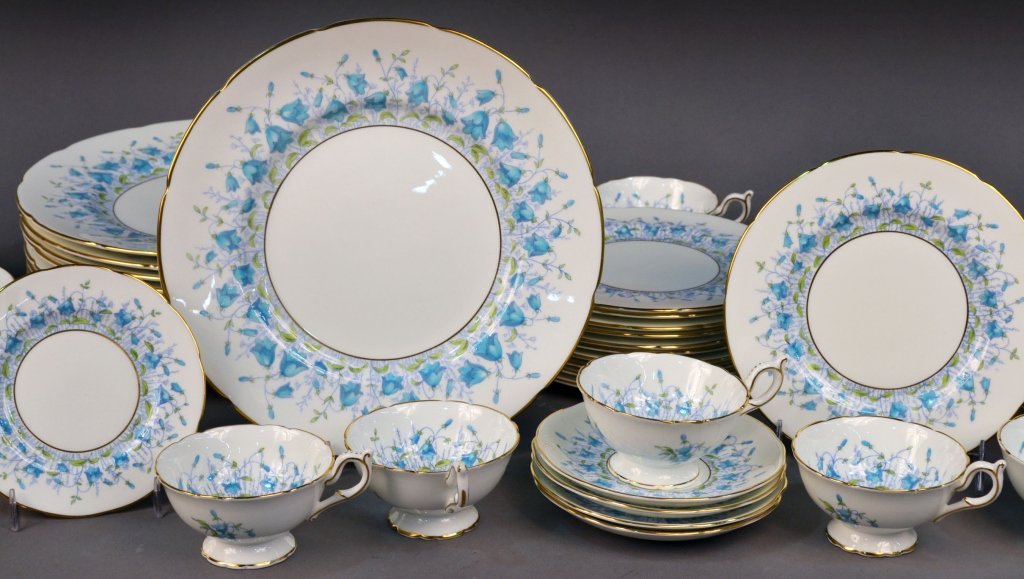 Coalport Porcelain Dinner Service: Harebell pattern, comprising twelve dinner plates, eleven salad plates, twelve bread plates, thirteen cups and thirteen saucers. Dinner plate diameter 10 1/2 inches.