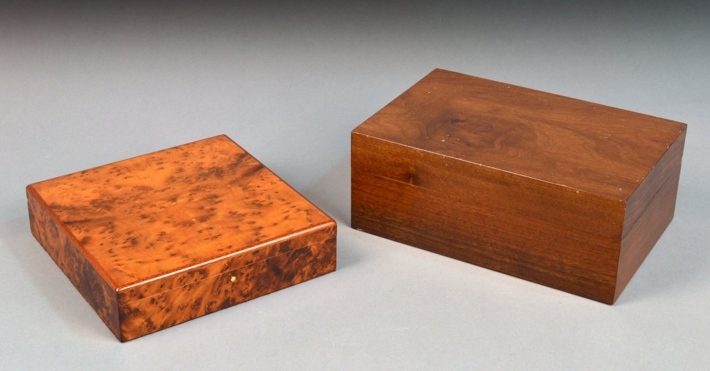 Two Humidors: One by Davidoff with removable tray and burl wood finish, the other by Lino with two removable dividers. Larger height 4 3/4 inches, width 12 inches, depth 8 inches.