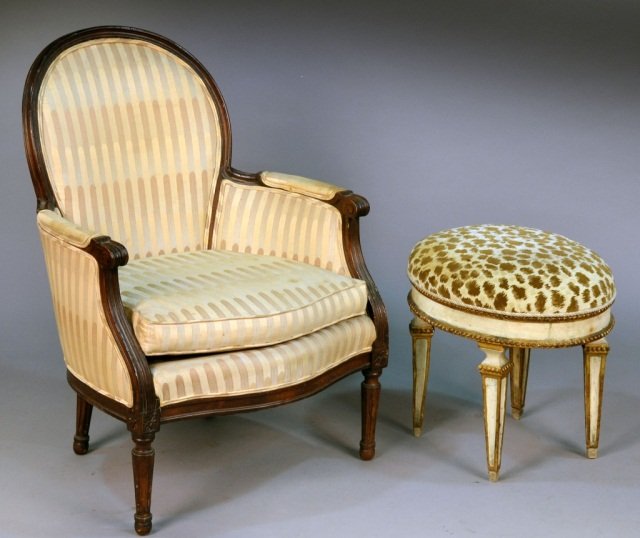 Louis XVI Style Painted Bergere: Together with an oval painted footstool. Chair, height 37 inches, width 26 inches, depth 22 inches; footstool, height 19 inches, width 22 inches, depth 16 inches.