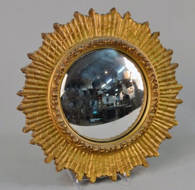 Gilt Wood Convex Mirror: Gilt painted with carved floral decoration. Diameter 17 inches.