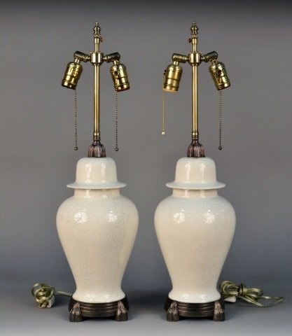 Pair of Ceramic Crackle Glaze Lamps: Ginger jar form two light lamps with silver plated mounts. Height 15 1/2 inches.