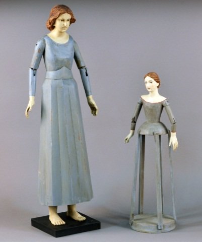 Two Carved and Painted Wood Dress Dolls: 19th century. Taller height 39 inches.