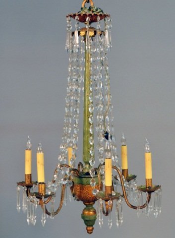 Gilt Wrought Iron and Carved Wood Chandelier: Six arm chandelier with crystal spears and lozenge shape rosettes. Height 46 inches, width 26 inches.