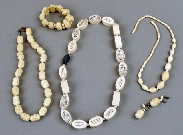 Group of Ivory & Bone Jewelry: Comprising a carved ivory scarab bracelet, a graduated bead necklace, length 16 inches, eighteen bead necklace, length 21 inches, and a carved bone necklace and earring suite.