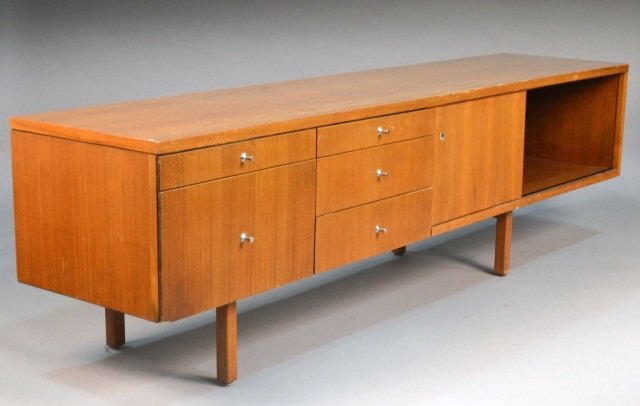 Mid Century Walnut Credenza: Rectangular top over an arrangement of two banks of drawers and cabinets. Height 26 inches, width 7 feet 8 inches, depth 20 1/2 inches.