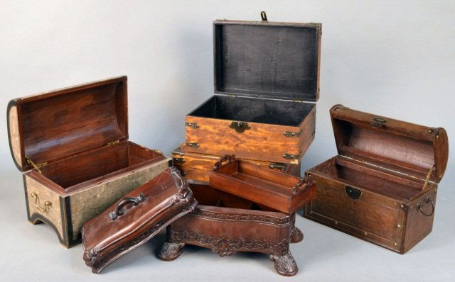 Miscellaneous Group of Five Decorative Boxes: Comprising a pair of wood boxes with metal mounts, a stone veneered chest, a carved wood chest with nail head decoration, and a carved wood tea caddy.