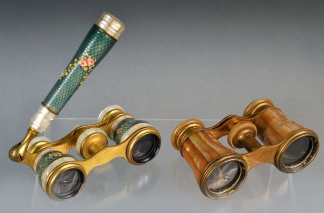 Two Pairs of Opera Glasses: One with mother of pearl overlay, the other with painted polychrome floral decoration over enamel and mother of pearl overlay with handle.