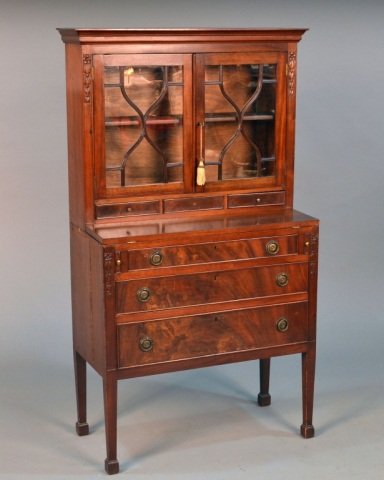 Federal Style Mahogany Secretary: Rectangular top with molded edge above two glazed doors and three short drawers, and a folding writing desk above three graduated drawers, on square tapered legs. Height 53 3/4 inches, width 31 1/2 in