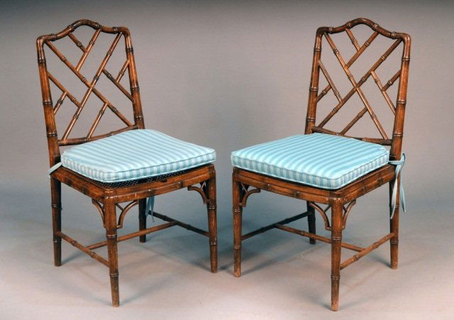 Pair of Faux Bamboo Side Chairs: Each with open back, caned seat, and legs joined by a H stretcher. Height 36 inches, width 19 inches, depth 19 inches.