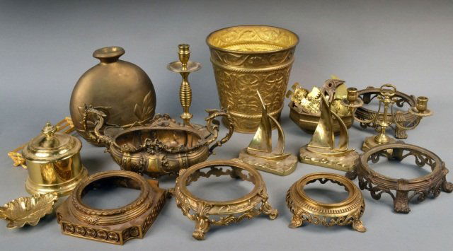 Miscellaneous Group of Brass Decorations: Including a pair of sailboat bookends, vase stands, a covered box, etc. Various sizes.