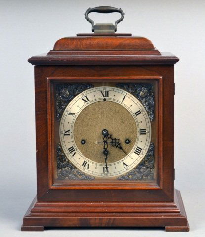 Seth Thomas Bracket Style Clock: Three train movement, dial with Roman numerals. Height over handle 14 1/2 inches.