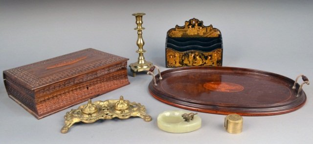Group of Stationery Articles: Comprising a papier mache letter rack, an onyx vide poche, a book form box, a brass candlestick and stamp hold and an oval mahogany two handle tray. Tray, length over handles 20 inches.