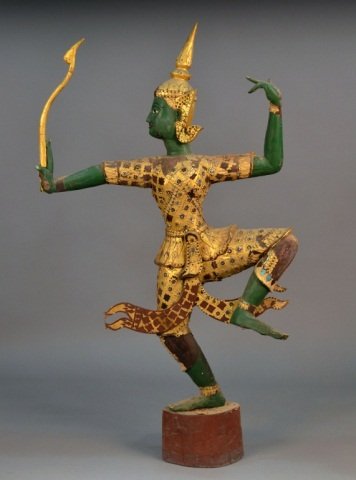 Balinese Carved Wood Figure: Posed with left foot raised. Height 60 inches.