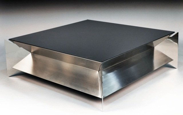 Glass Top Steel Coffee Table: Black glass top on a steel space age designed base. Height 16 inches, 50 1/2 inches square.