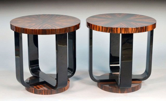 Pair of Art Deco Macassar Ebony Side Tables: Each with circular top on rectangular supports on a conforming base. Height 24 inches, diameter 24 inches.