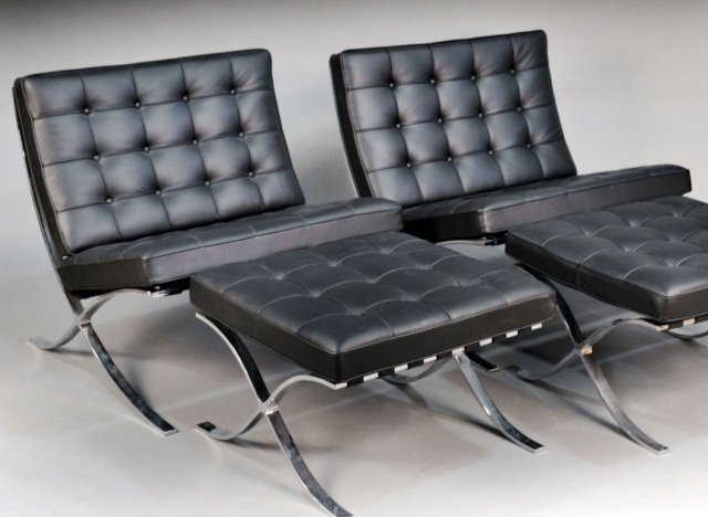 Pair of Black Leather Barcelona Chairs and Stools: Design by Ludwig Mies van der Rohe, 1929. By Knoll. Height 30 1/4 inches, width 29 1/2 inches, depth 30 inches.