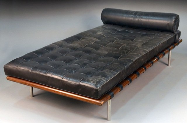 Black Leather Barcelona Couch: Designed in 1930 by Ludwig Mies van der Rohe to accompany the Barcelona collection, for Knoll. Height 25 inches, length 6 feet 6 inches, width 38 inches.