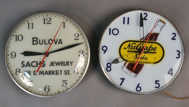 Two Advertising Clocks: Bulova, Sachs Jewelry and NuGrape Soda. Diameter 15 inches.