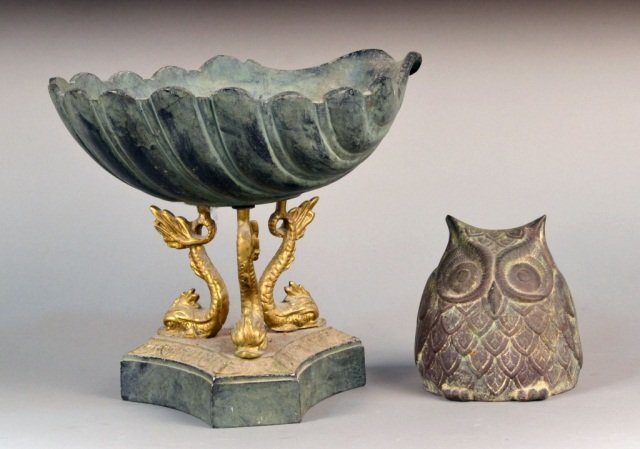 Shell Centerpiece and Owl: Patinated metal seashell on three gilt metal dolphin form supports on a tripartite base; together with a cast iron owl figure. Centerpiece, height 10 inches.