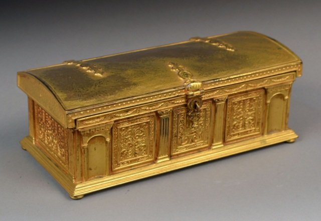 Tiffany Studios Gilt Bronze Casket: Domed cover, rectangular box with architectural decoration, green velvet lining with removable tray. Height 3 inches, width 8 inches, depth 3 1/2 inches.