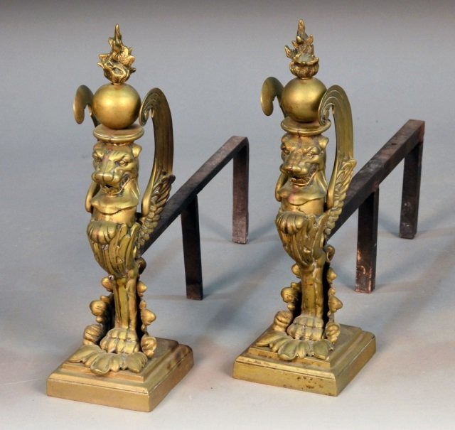 Pair of Brass Andirons: Figural griffin decor. Height 19 inches.