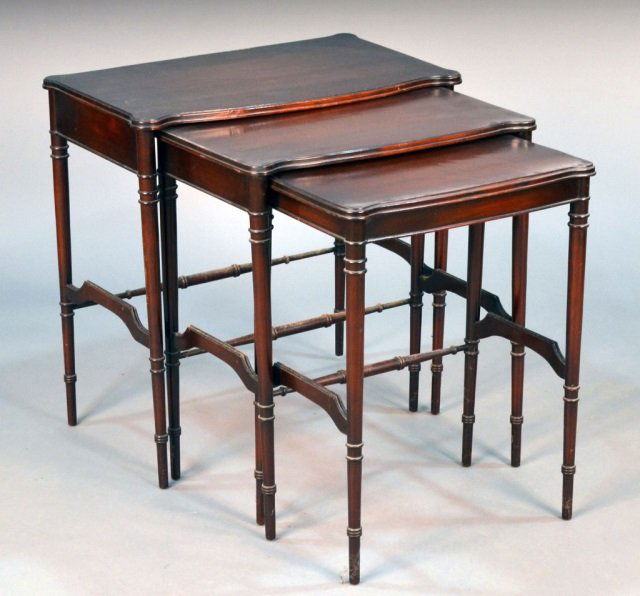 Set of Three Nesting Tables: Shaped rectangular top, on turned tapered legs and three quarter box stretcher. Height 25 inches, width 25 inches, depth 14 inches. Provenance: Estate of Leo Barrile, Leo's Antiques in Bensonhurst NY