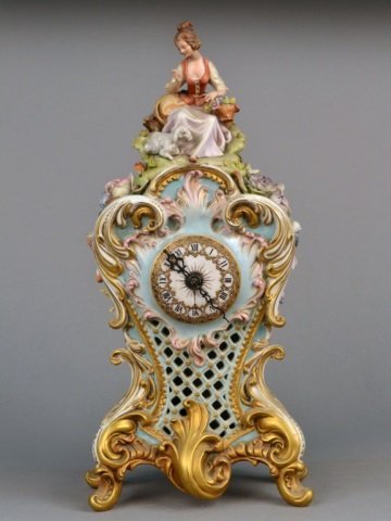 Italian Porcelain Clock Case: Applied flowers and with gilt scroll accents. Height 18 inches. Provenance: Estate of Leo Barrile, Leo's Antiques in Bensonhurst NY