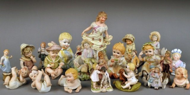 Group of Porcelain Figures of Children: Various makers, mostly biscuit. Tallest height 11 inches. Provenance: Estate of Leo Barrile, Leo's Antiques in Bensonhurst NY