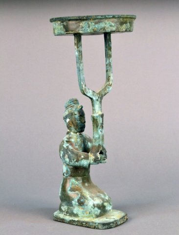 Bronze Figure of a Man: Modeled holding a stand. Height 15 3/4 inches.