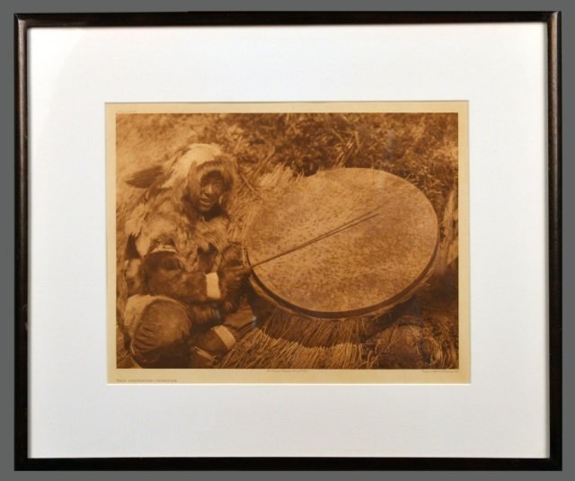 Edward Sheriff Curtis (American, 1868-1952): The Drummer - Nunivak. Vintage Photogravure, original image circa 1928, printed by John Andrew & Son and Suffolk Engraving Co. Credited (l.c.), copyrighted (l.r.), titled (l.l.), plate # 692 (u.l.). I