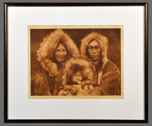 Edward Sheriff Curtis (American, 1868-1952): A Family Group - Noatak. Vintage Photogravure, original image circa 1928, printed by John Andrew & Son and Suffolk Engraving Co. Credited (l.c.), copyrighted (l.r.), titled (l.l.), plate # 717 (u.l.).