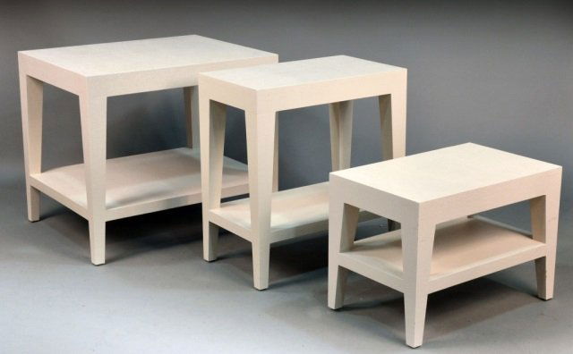 Set of Three Karl Springer Style Tables: Graduating sizes. Each with rectangular top on four square tapered legs, joined by a lower conforming shelf. Largest height 27 inches, width 30 inches, depth 24 inches.