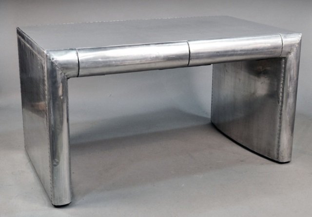 Aircraft Aluminum Desk: Late 20th century, In the manner of Dolph Bode, rectangular top above two drawers. Height 32 inches, width 59 inches, depth 35 inches.