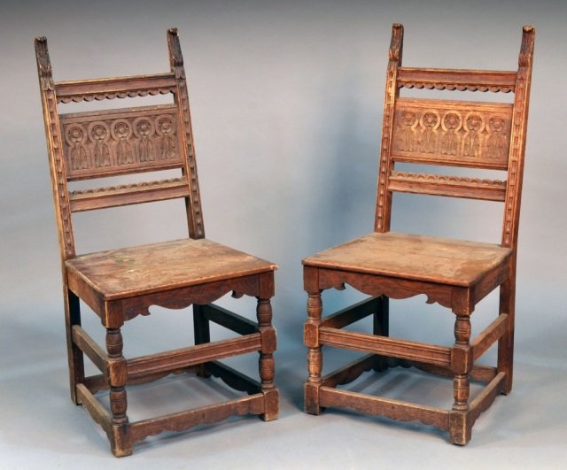 Two English Hall Chairs: Each with carved back, panel seat and turned legs joined by a box stretcher. Height 40 inches, width 19 inches, depth 18 inches