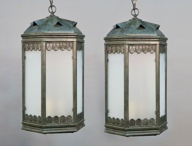 Pair of Patinated Tole Lanterns: With frosted glass panels. Height 28 inches, width 13 inches.