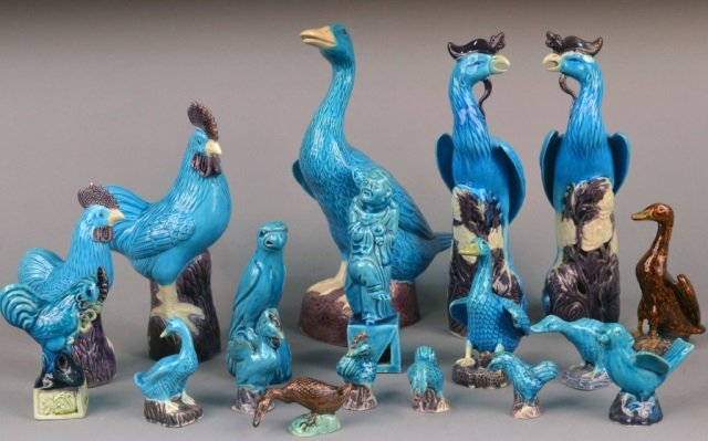 Group of Chinese Blue Glazed Figures: Including a pair of peacocks, roosters and hens, ducks, etc.; together with two brown glazed ducks. Tallest, height 10 inches.
