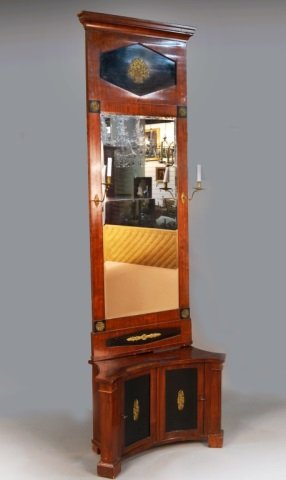 Empire Part Ebonized Mahogany Mirror and Console: Rectangular mirror with molded cornice with applied gilt metal floral decoration, beveled glass flanked by two brass single light sconces, 6 feet 8 inches x 30 1/2 inches; the concave base with a two 