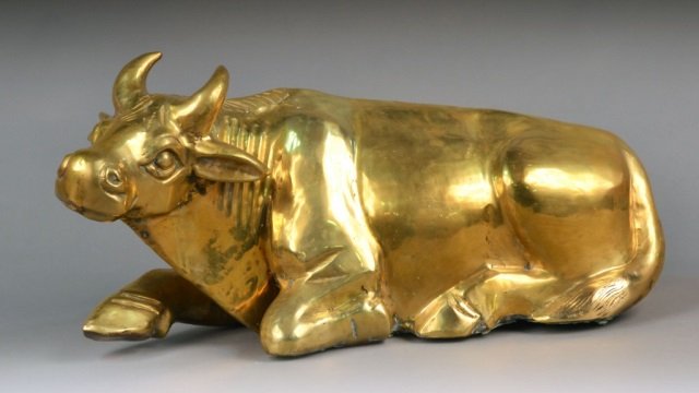 Brass Water Buffalo: Modelled in reclining position. Length 24 inches.