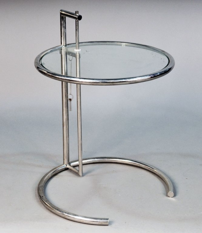 Eileen Gray Glass and Chrome Side Table: Inset circular glass top, tubular chrome base. Height 27 inches, diameter 20 inches.