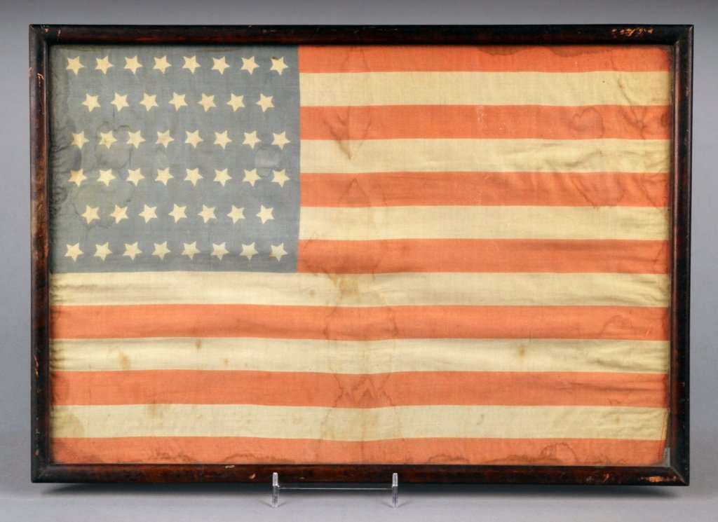 Forty-Six Star American Parade Flag: 1908-1912 period, “8-7-8-8-7-8” pattern forty-six star American parade flag, Oklahoma. Approximately 11 3/4 x 17 inches. Framed.