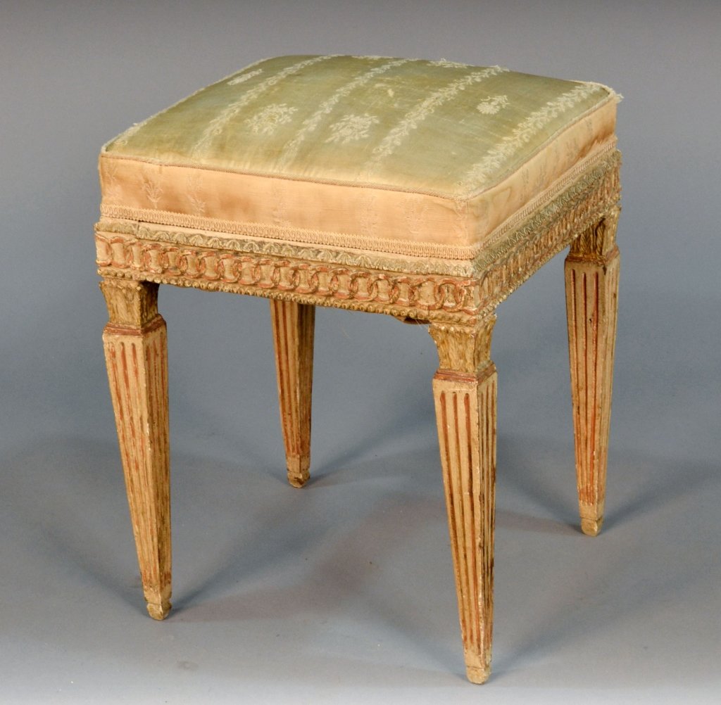 Louis XVI Painted Footstool: Neoclassical style upholstered top on square tapered fluted legs. Height 19 1/2 inches, width 15 1/2 inches, depth 15 1/2 inches.