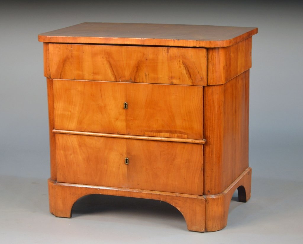Biedermeier Fruitwood Commode: Rectangular lift top with rounded front corners over two drawers, bracket feet. Height 30 inches, width 31 3/4 inches, depth 20 1/2 inches.