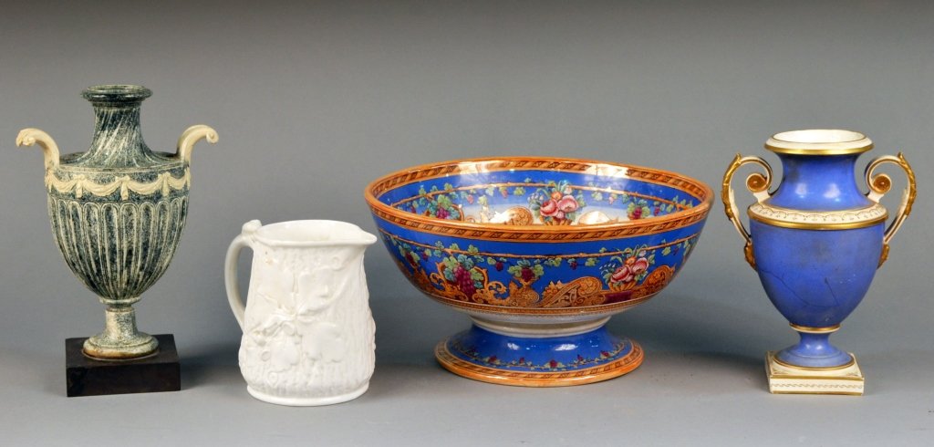 Four English Ceramic Table Decorations: Center bowl with floral and scroll border, a Minton pitcher, Wedgwood style urn and a Vienna style porcelain urn. Bowl, height 6 1/2 inches, diameter12 3/4 inches.