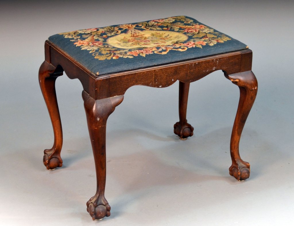 Needlepoint Upholstered Mahogany Stool: Rectangular seat, on cabriole legs, ball and claw feet. Height 18 inches, width 22 inches, depth 16 inches.