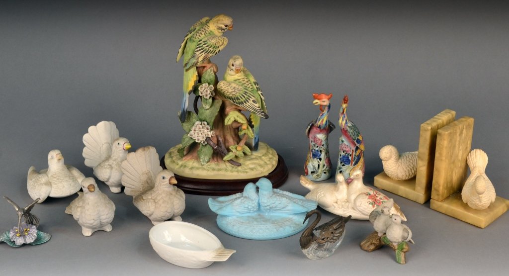 Group of Figures of Birds and Doves: Including a pair of bookends, pair of peacocks, dove box, etc . Tallest height 10 3/4 inches. Provenance: Estate of Leo Barrile, Leo's Antiques in Bensonhurst NY