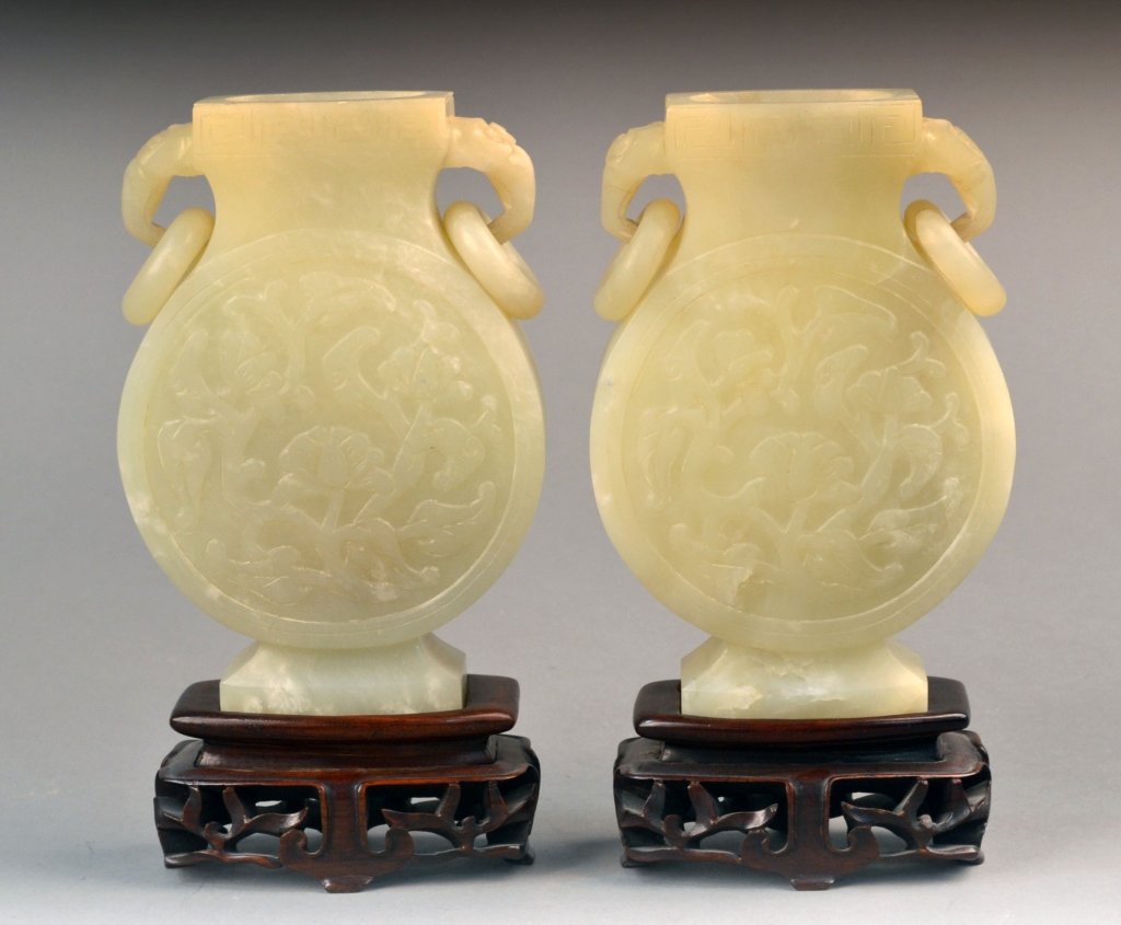 Pair of Chinese Carved Hardstone Flasks: Each, adorsed with articulated rings, on wood base. Overall height 9 inches.